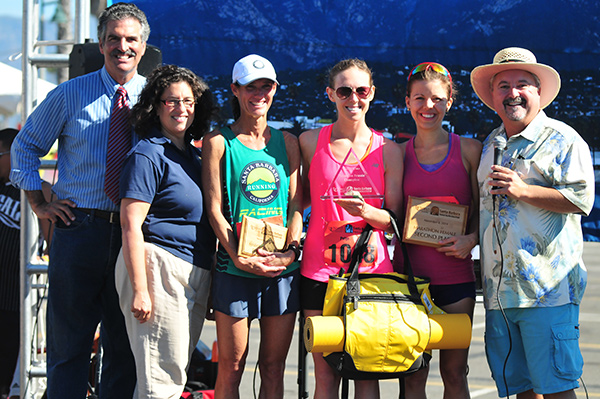 The women's winners were announced by Award Ceremony MCs John Palementari, left, and Drew Wakefield, right, and joined by Santa Barbara Mayor Helene Schneider. Athletes include Deanna Odell, left, Paige Burgin, middle, and Jen Marquardt, right.