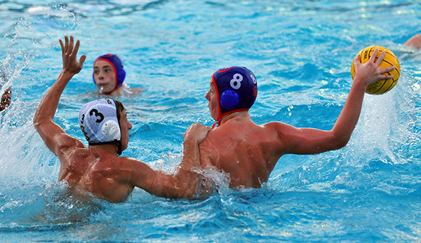 San Marcos' Jesse Morrison is weighted down by Santa Barbara defender Jack Beeson. (Presidio Sports Photos)