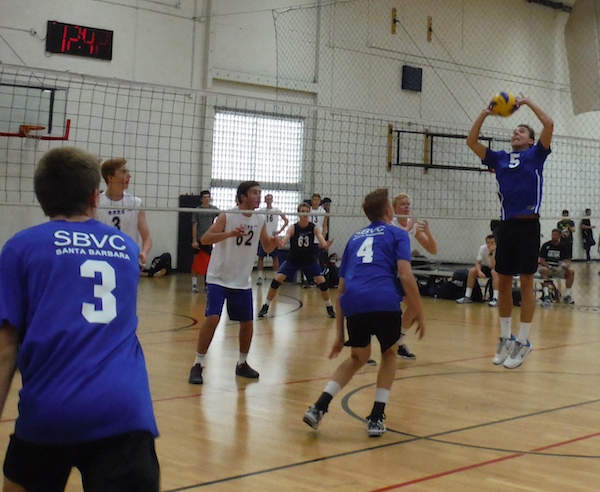 Cord Pereira sets the ball as SBVC 17-Blue hitters prepare to attack.