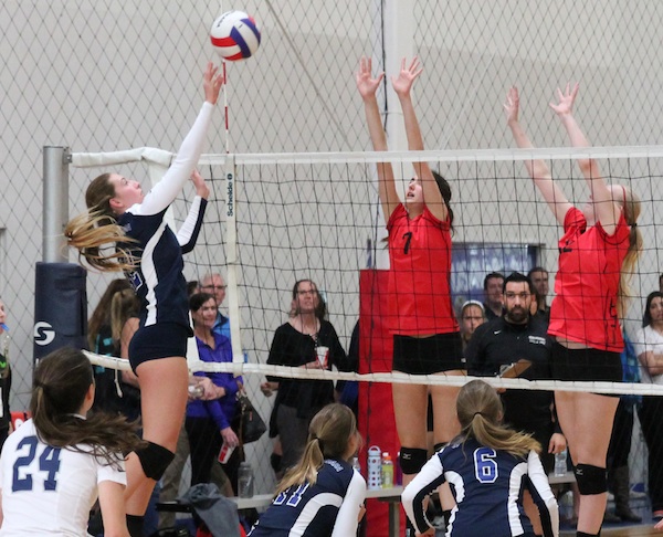 Jenna MacFarlane of the SBVC 15-Blue tips over the block during a qualifying tournament match.