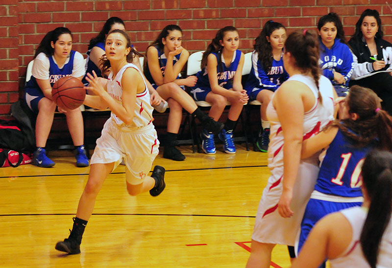 Bishop Diego's Morgan Wallace drives to the basket as teammate Hannah Rogers sets a screen.