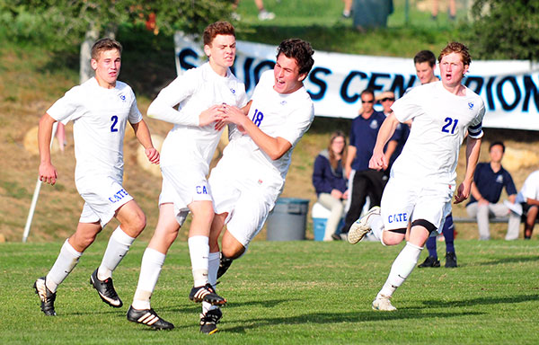 Cate's Ryan Borchardt is chased by teammates after scoring the game's first goal on Friday. (Presidio Sports Photos)