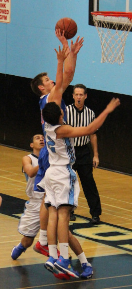 Scott Everman of San Marcos scores two of his 23 points in playoff game against Buena.