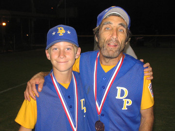 Dylan Rohde shares a championship moment with Coach Buddy in 2006  (Courtesy of Rohde Family)
