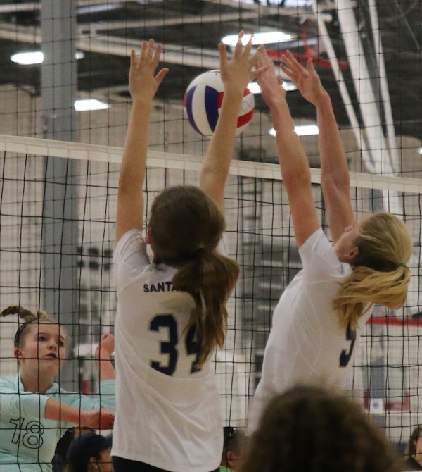 Chloe Mauceri and Ally Mintzer combine to block an attack for the SBVC 14-Blue