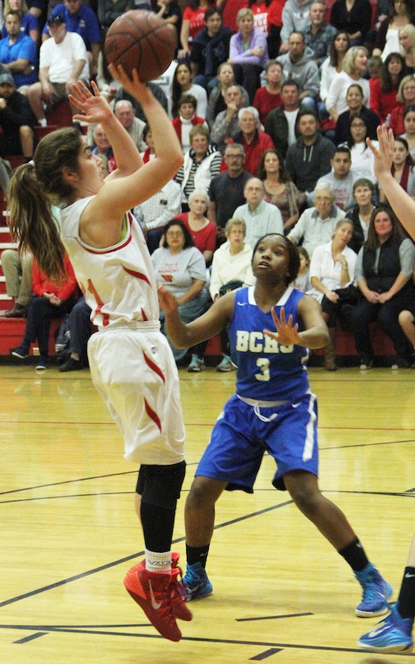 Bishop's Jordyn Lilly pulls up for a jumper against Bakersfield Christian's Kameron Taylor. Lilly scored a game-high 23 points.