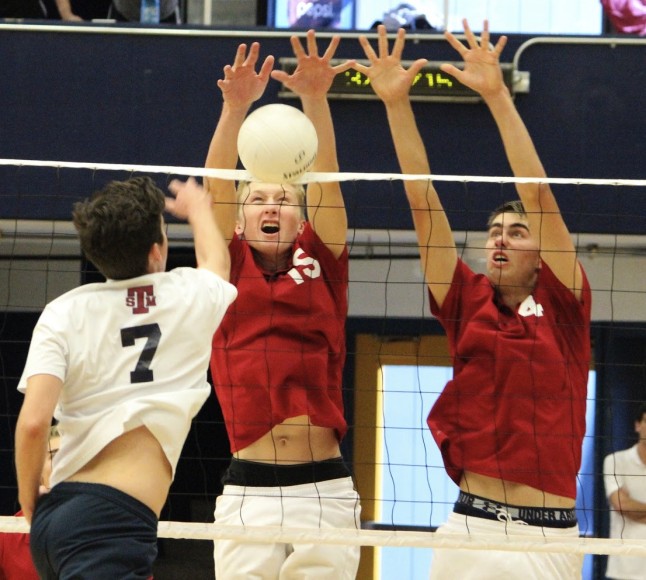 Ben Hauschild, left, and Jake Castanha combine to block a ball during the Dos Pueblos Invitational.