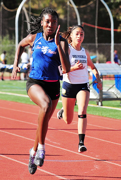San Marcos freshman Jennifer Nnoli sprints to victory in the 100 meters.