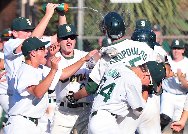 The Dons celebrate their extra-inning walk-off win on Friday. (Presidio Sports Photos)