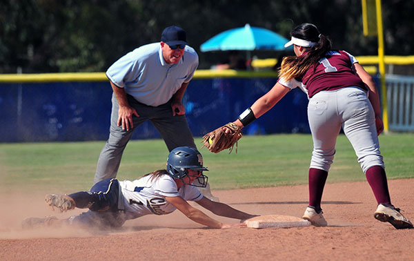 Dos Pueblos' Lauren Marmo beats the tag from Torrance shortstop Jade Arslanian for a stolen base. 