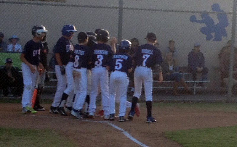 Jared Vom Steeg is mobbed by his Goleta Valley South teammates after belting a grand slam in the first inning.