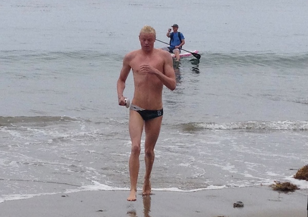 Alex Roderick emerges from the water as the champion of the Semana Nautica 6-Mile Ocean Swim.