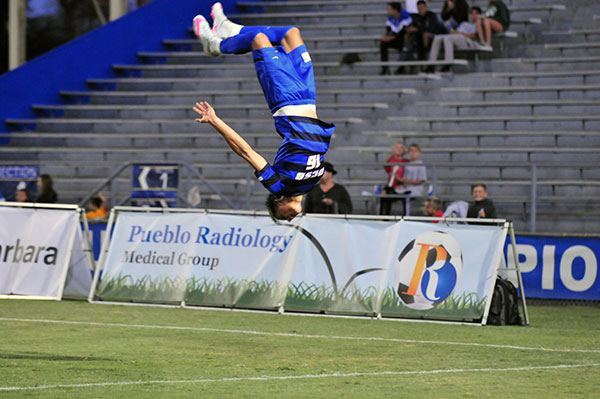 Kevin Feucht does a back flip after scoring UCSB's third goal.