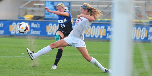 UCSB newcomer Mallory Hromatko takes a shot past Westmont defender Renee Gonsalves in Thursday's exhibition opener at Harder Stadium. (Presidio Sports Photo)