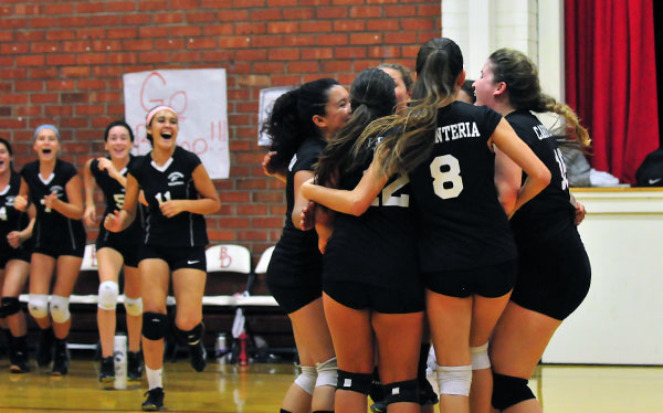 The Warriors celebrate their victory after match point. (Presidio Sports Photos)