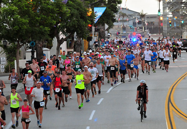 Runners get started on lower State Street just before sunrise. 