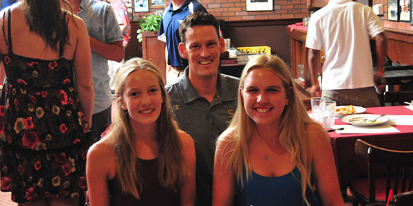 Santa Barbara High volleyball coach John Gannon with his sophomore standouts Linnea Skinner, left, and Erika Foreman.