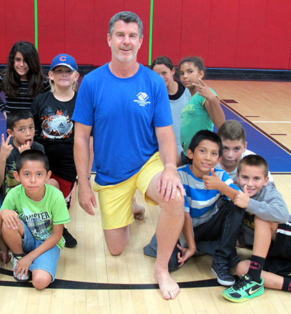 John Gavin is surrounded by kids at the Santa Barbara Boys & Girls Club. (Courtesy Photo)