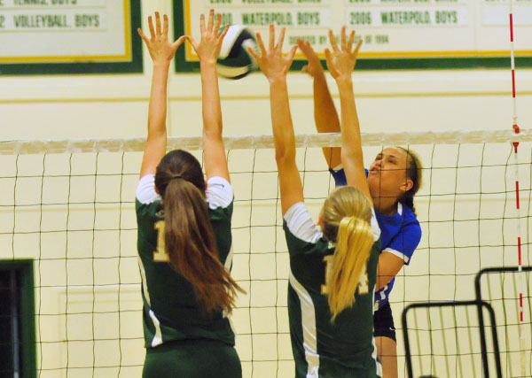 Lucy Branch, left, and Chloe Mauceri put up a block on San Marcos' Chloe Allen.