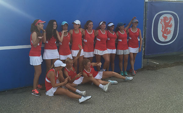 San Marcos' girls tennis team gets together for a league title team photo. 