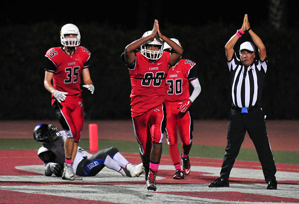Cardinals sophomore Will Goodwin celebrates Bishop's safety in the third quarter. 
