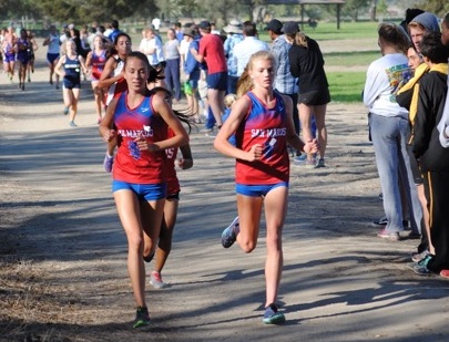 San Marcos' Erica Schroeder, left, and Natalie McClure finished first and second at the county championships.