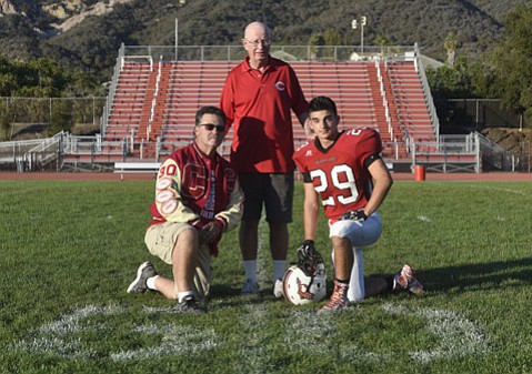 Tim Jimenez Sr., left, with son Timothy Jimenez Jr., right, and legendary Carpinteria football coach Lou Pannizon.