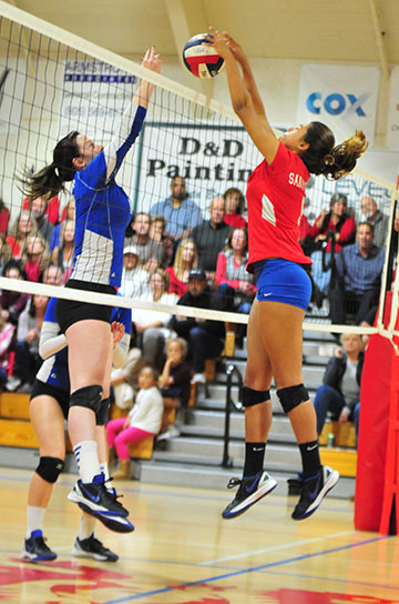Gabi Peoples wins a ball at the net against Agoura. 