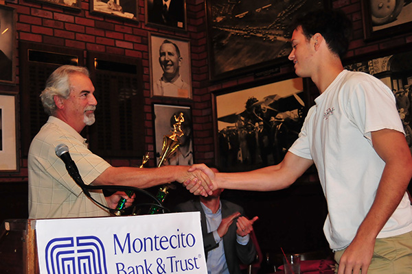 Brent Peus of Santa Barbara High receives the Gary Blades Memorial Big Game MVP Trophy from award sponsor Mike Rabe