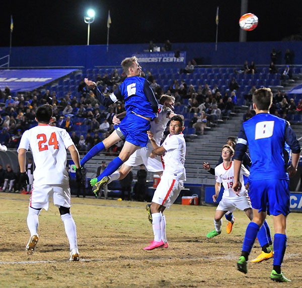 UCSB's Nick DePuy skies for a corner kick in the first half. 