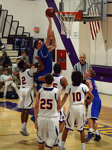 Sophomore Jackson Stormo puts in a layup against Righetti.