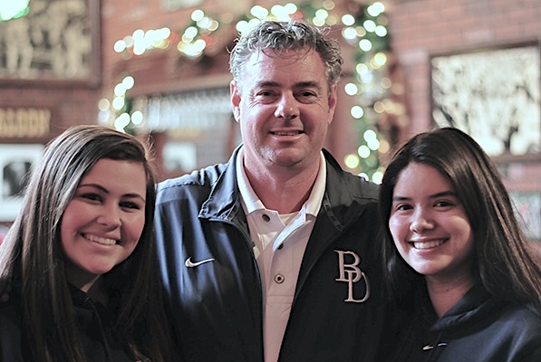 Bishop Diego girls basketball coach Jeff Burich with players Kylie Koeper, left, and Veronica Morones.