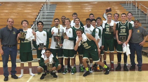 Santa Barbara High boys basketball team celebrates winning the Simi Valley Tournament title.